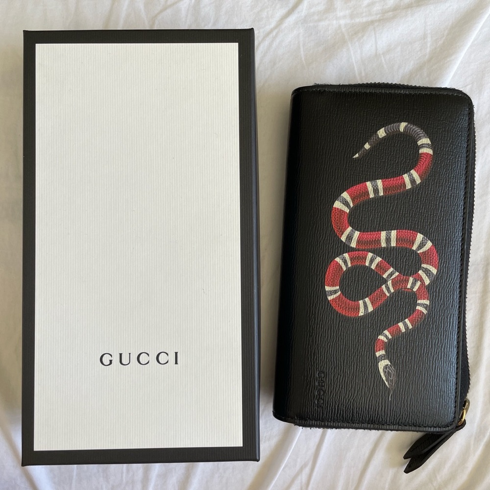 Gucci black snake print leather zip around wallet.